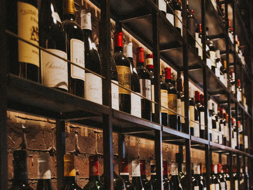 Wine bottles on a wooden rack